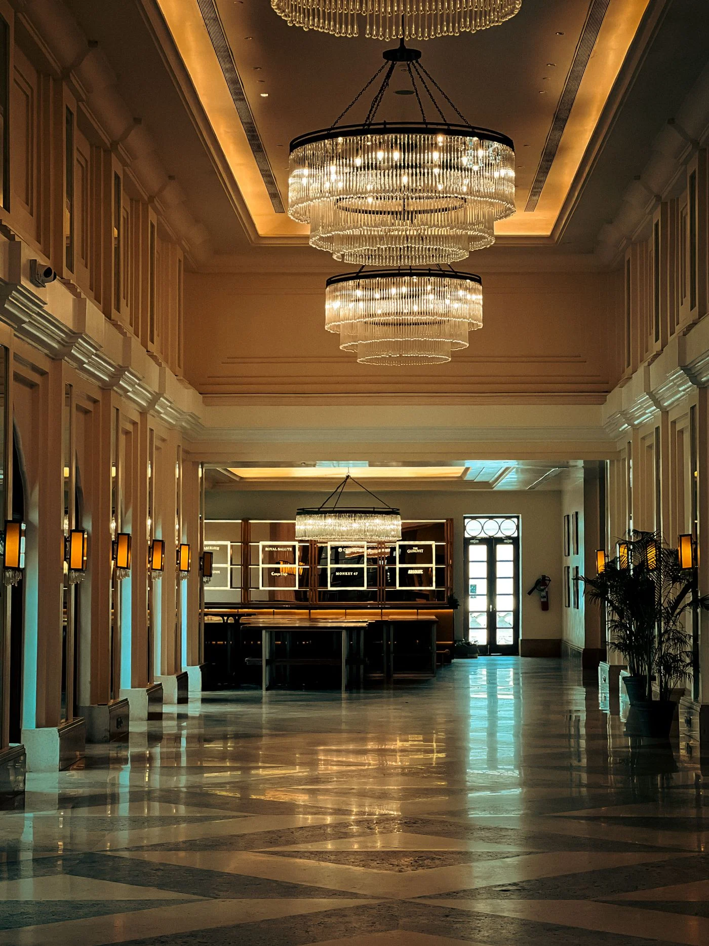 Grand hotel lobby with crystal chandeliers